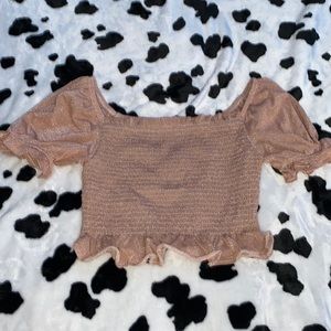 Pink ruffle shirt. Has a sparkly look to it. Super cute and comfortable